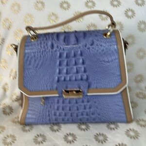 Periwinkle with tan leather trim. Gold hardware. Gold side panels. 13x12 high.